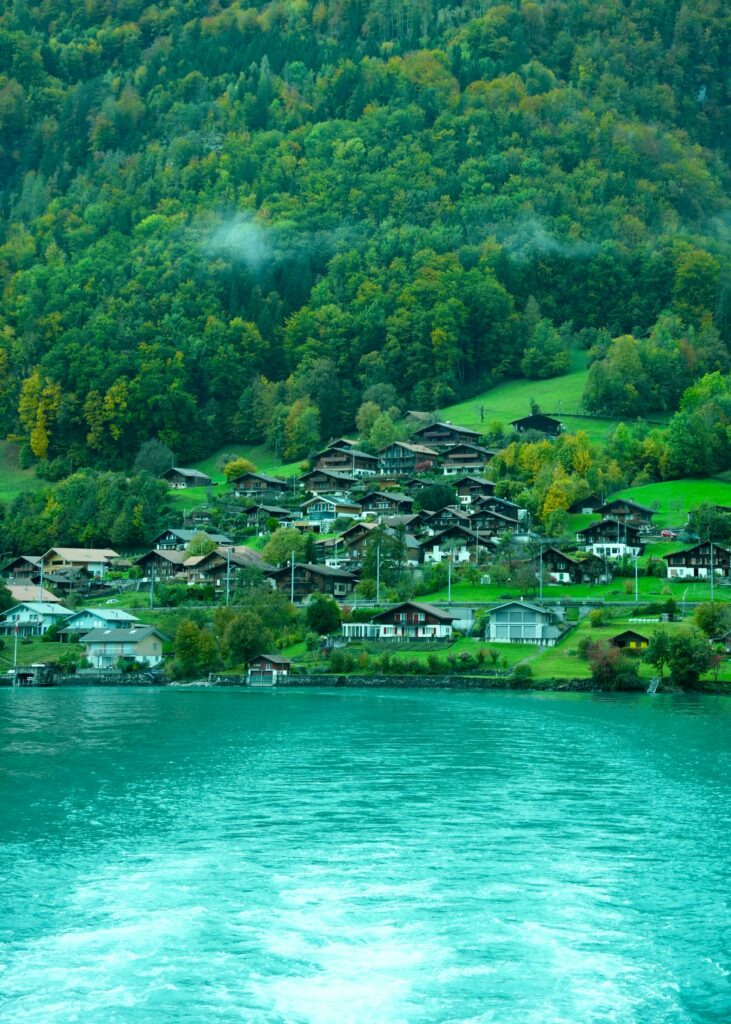 A small village on the shore of a lake A small village on the shore of a lake
