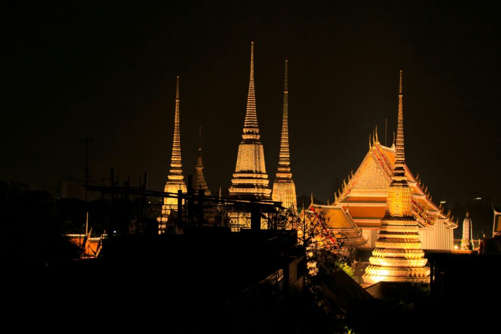 a night view of a large building with many spires a night view of a large building with many spires