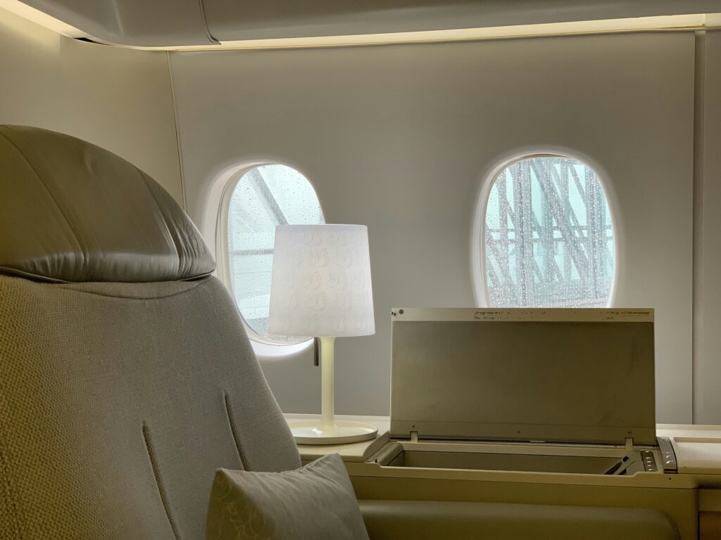 a room with a lamp and a window