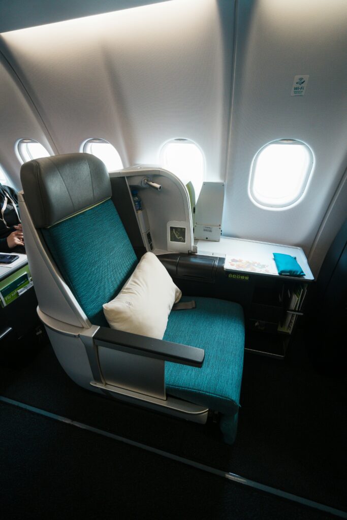 a seat on an airplane with a pillow on it