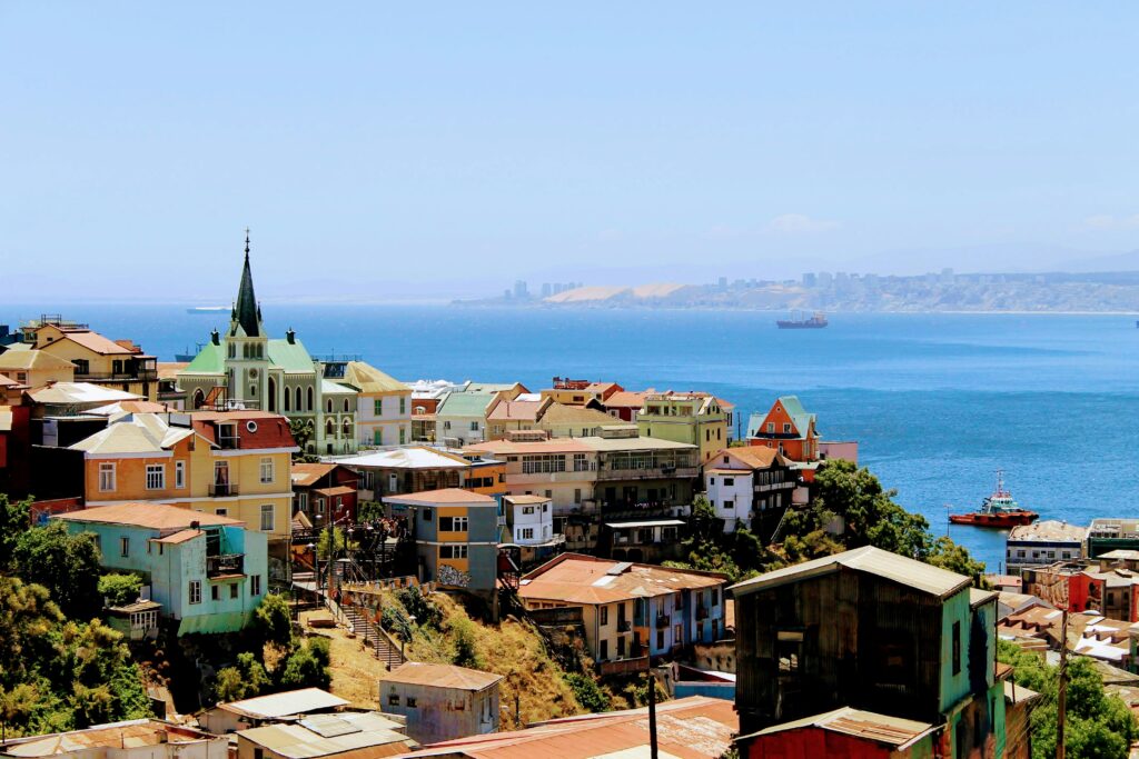 a view of a city with a large body of water in the background a view of a city with a large body of water in the background