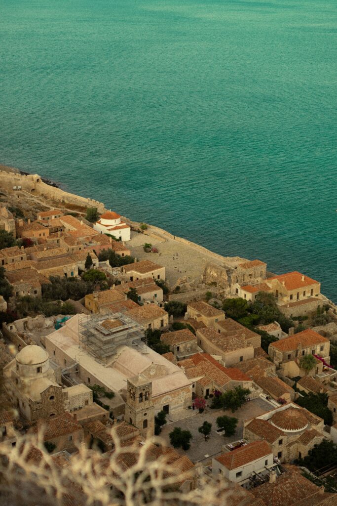 an aerial view of a city next to the ocean an aerial view of a city next to the ocean